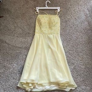 Yellow sparkly open back dress